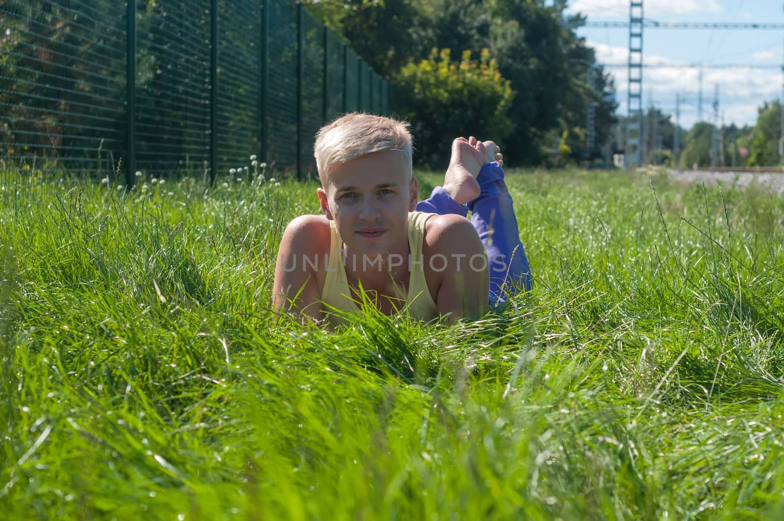 Man lying in a grass by anytka