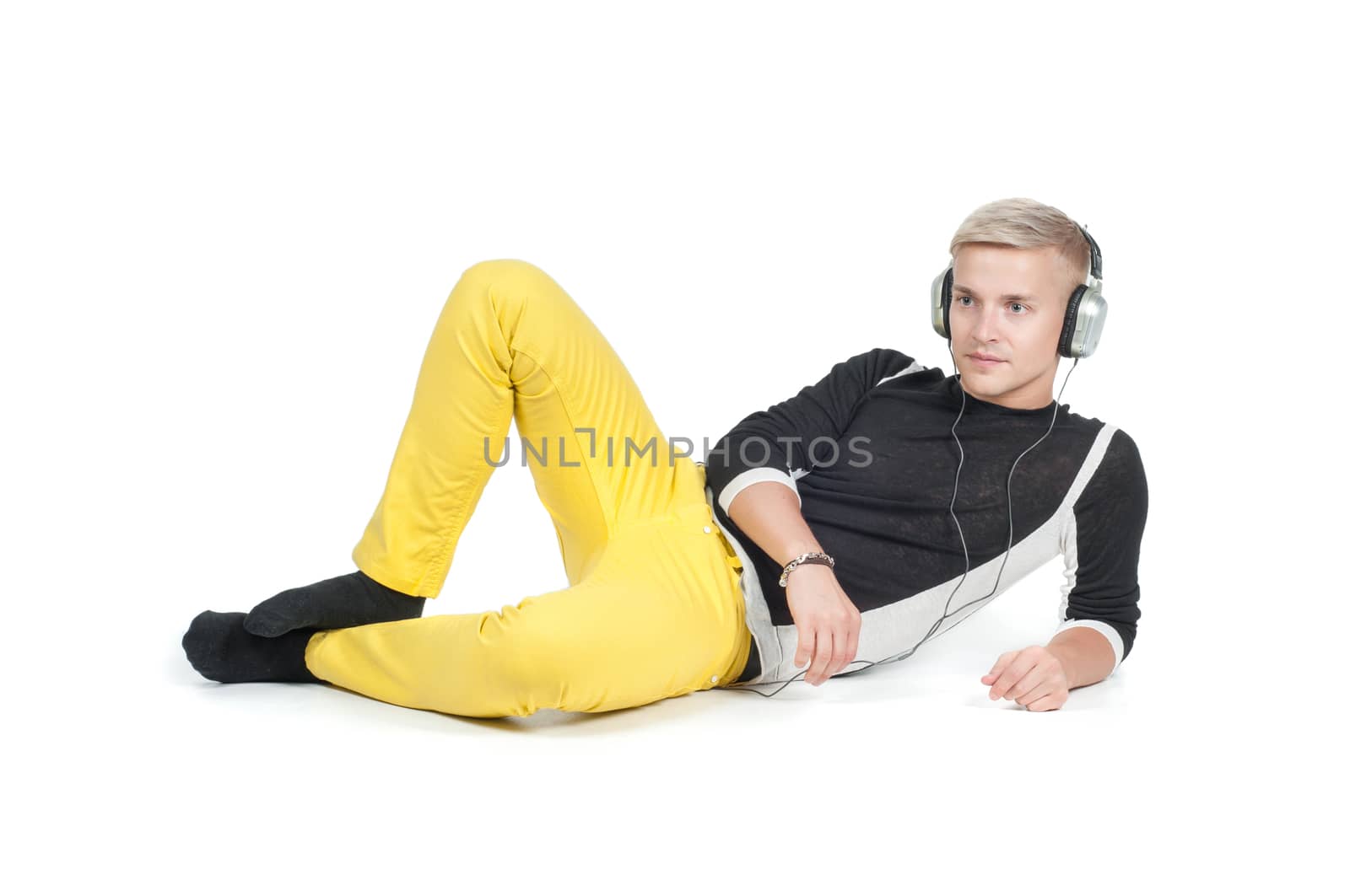 Man in headphones and yellow jeans isolated on white