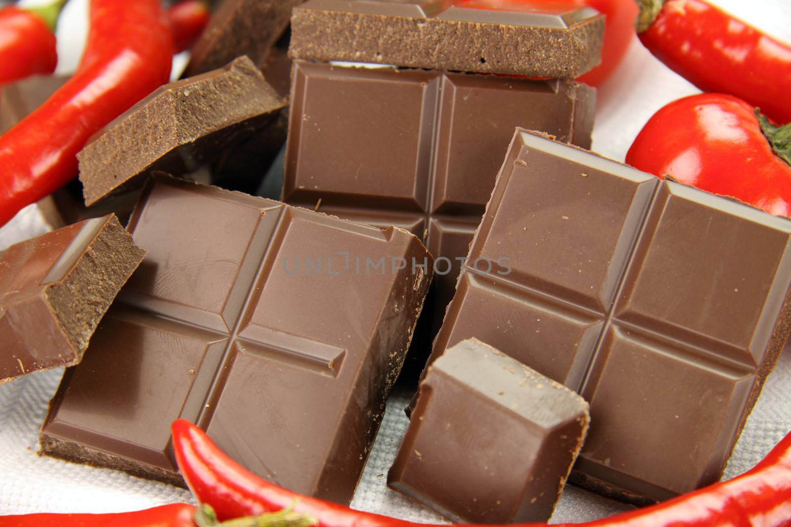 Delicious dark chocolate with a selection of different chilies and peppers.