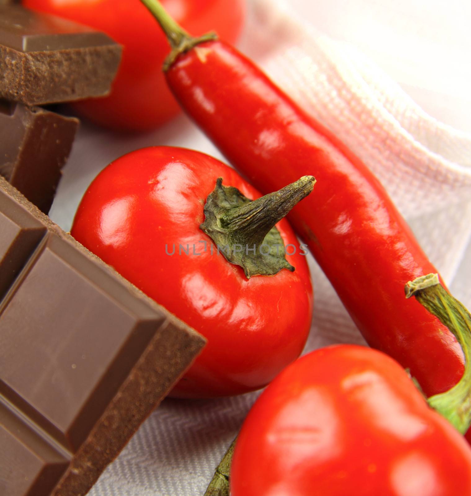 Delicious dark chocolate with a selection of different chilies and peppers.