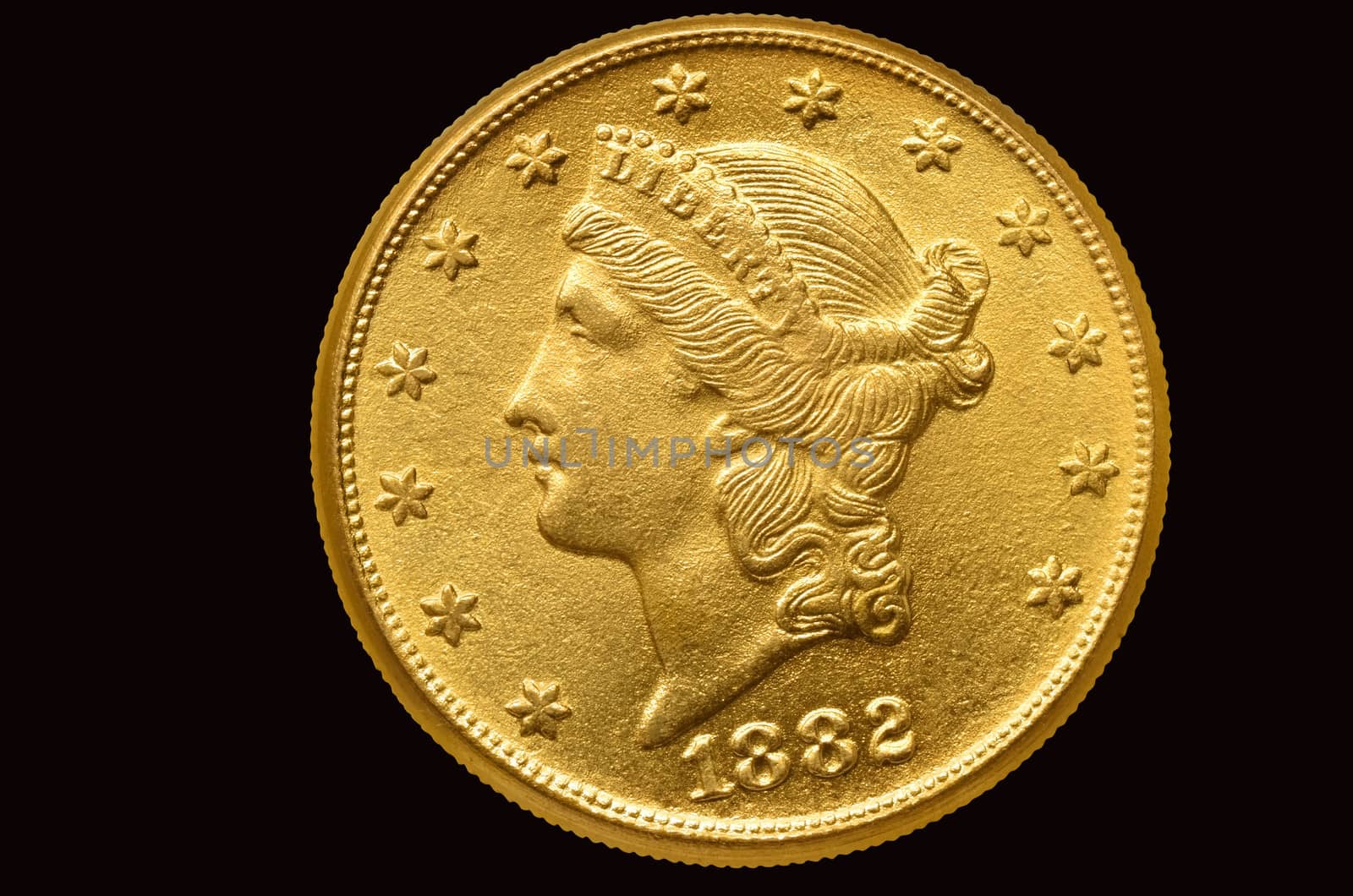 20 Liberty golden dollar coin. Isolated with path on black background