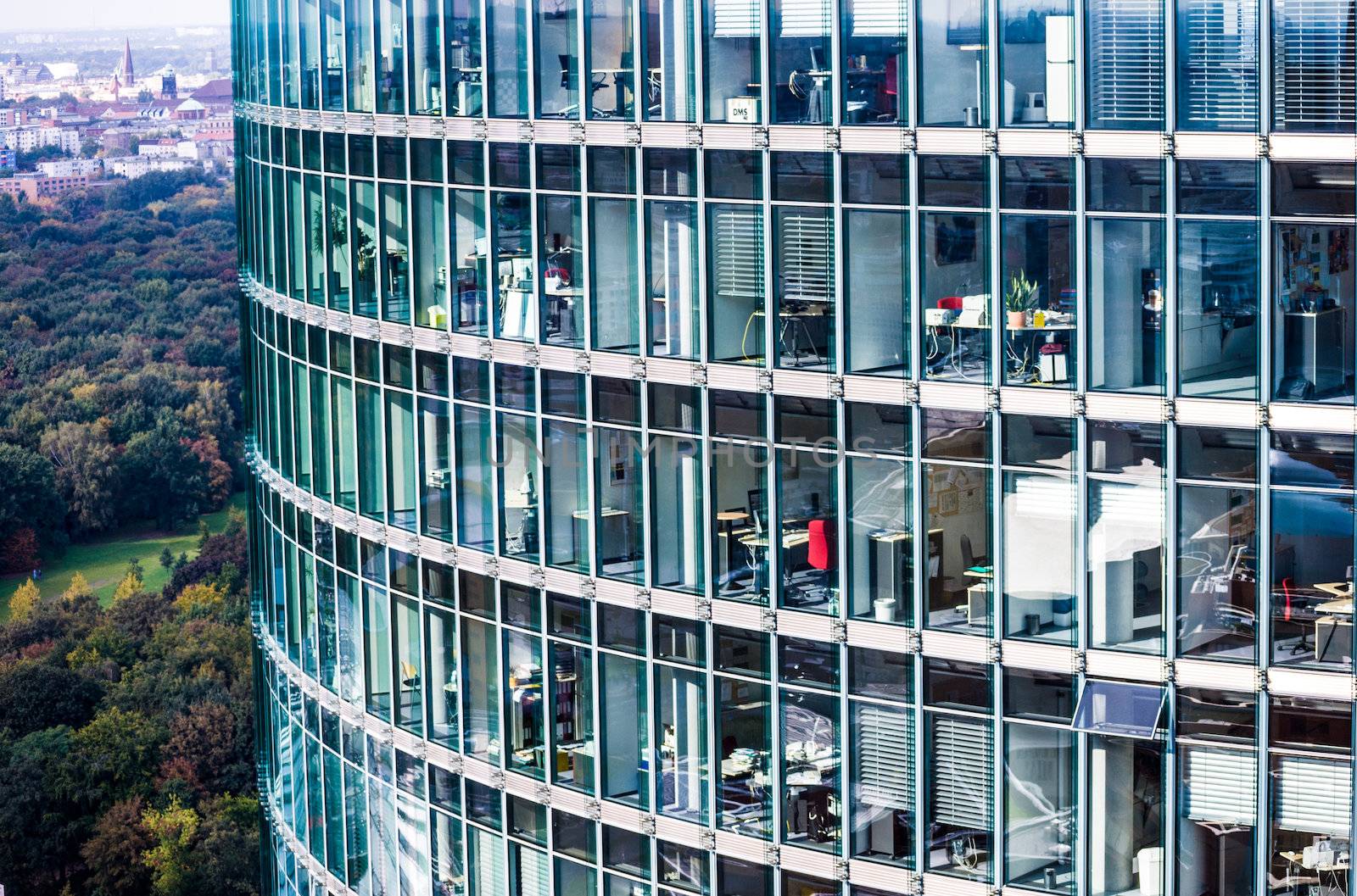 looking inside many offices of a skyscraper