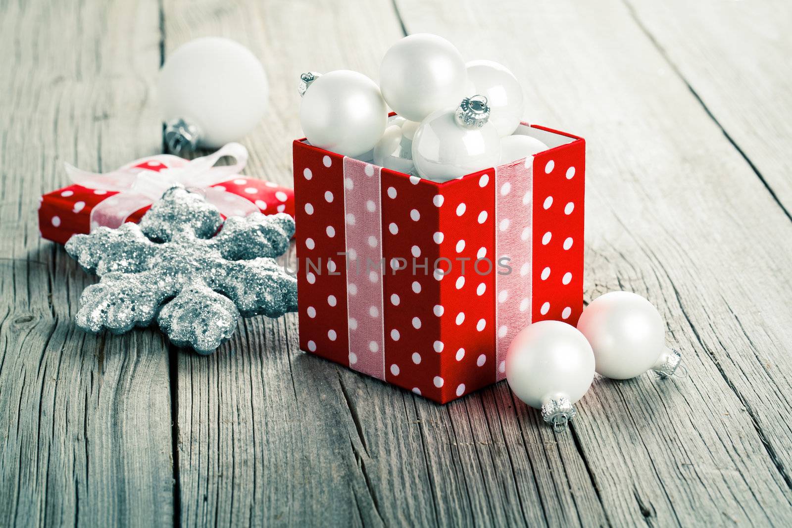 red gift box, polka dots with, on wood background