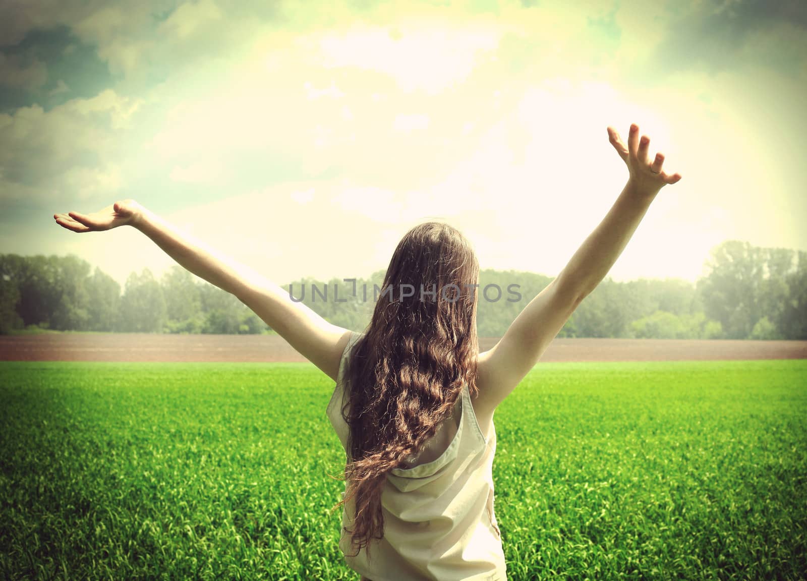 Vintage photo of Happy teenage girl in the summer field