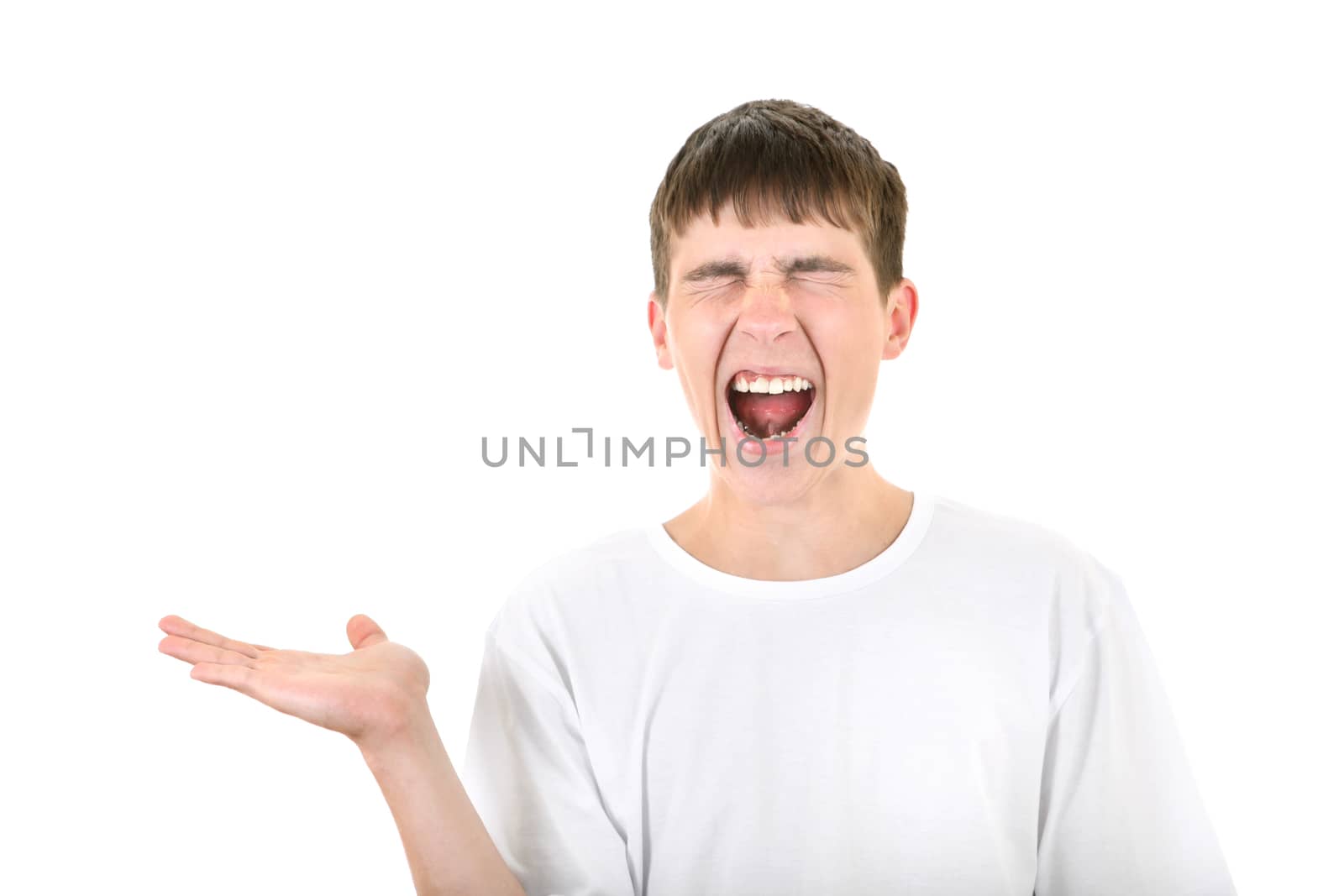 Teenager is screaming and showing his Empty Palm Isolated On The White Background