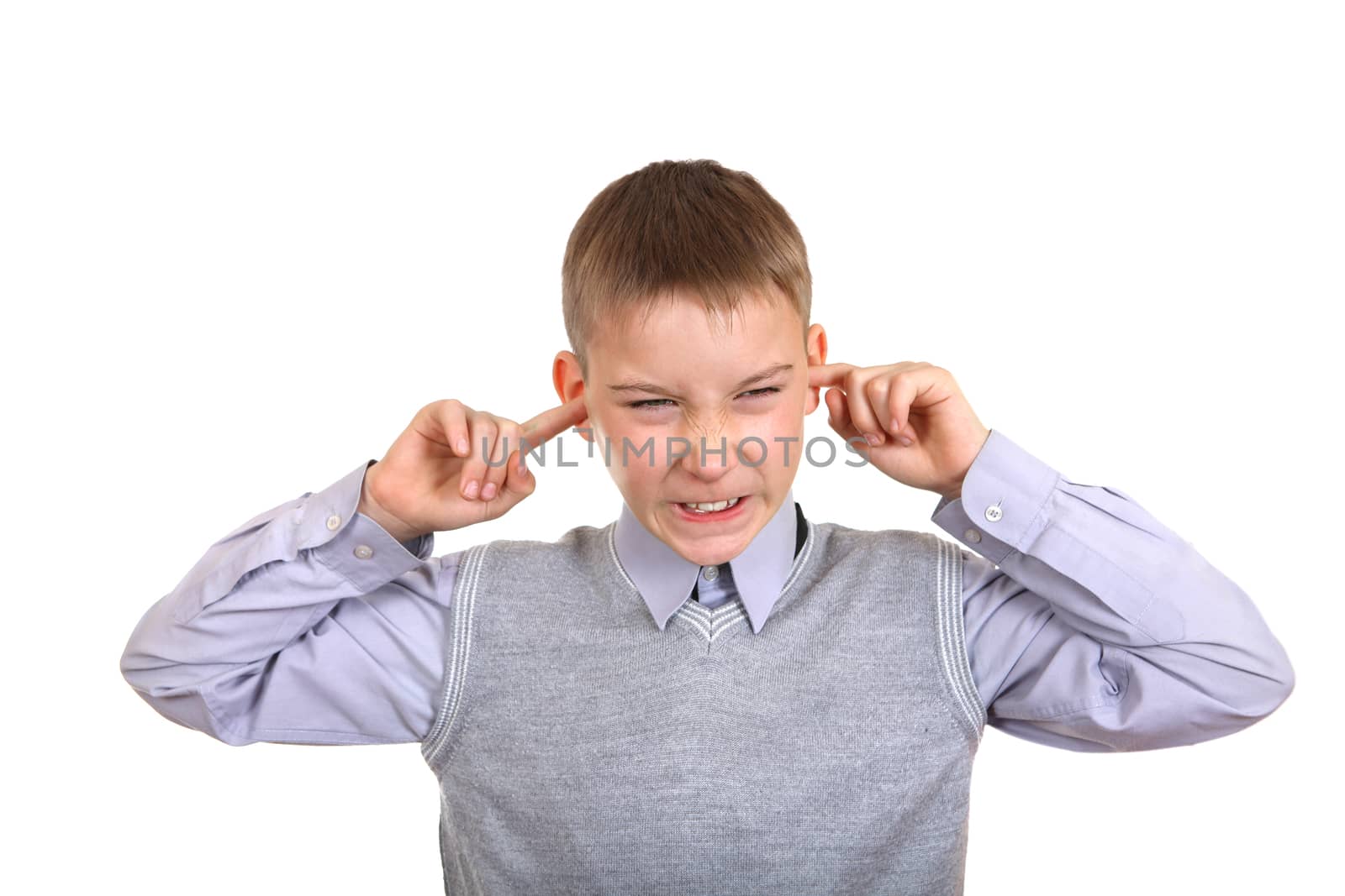 Displeased Boy covering his Ears from the Noise. Isolated on the White Background