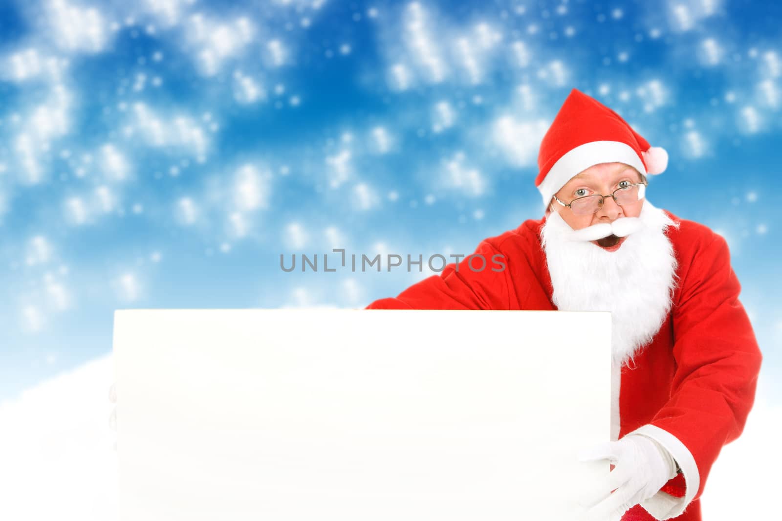 Surprised Santa Claus with Blank Board on the Abstract Winter Background