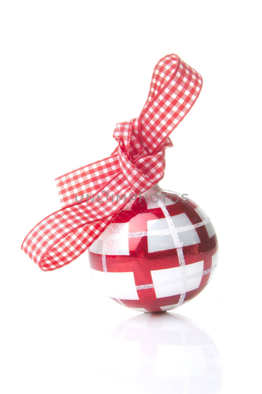 red and white christmas bauble with loop isolated with white background 