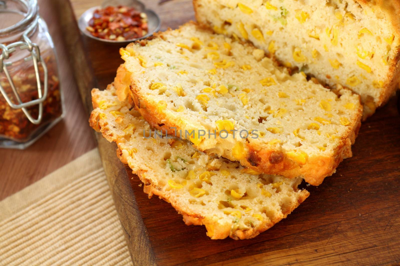 Fresh baked sliced corn bread with dried chillies ready to serve.