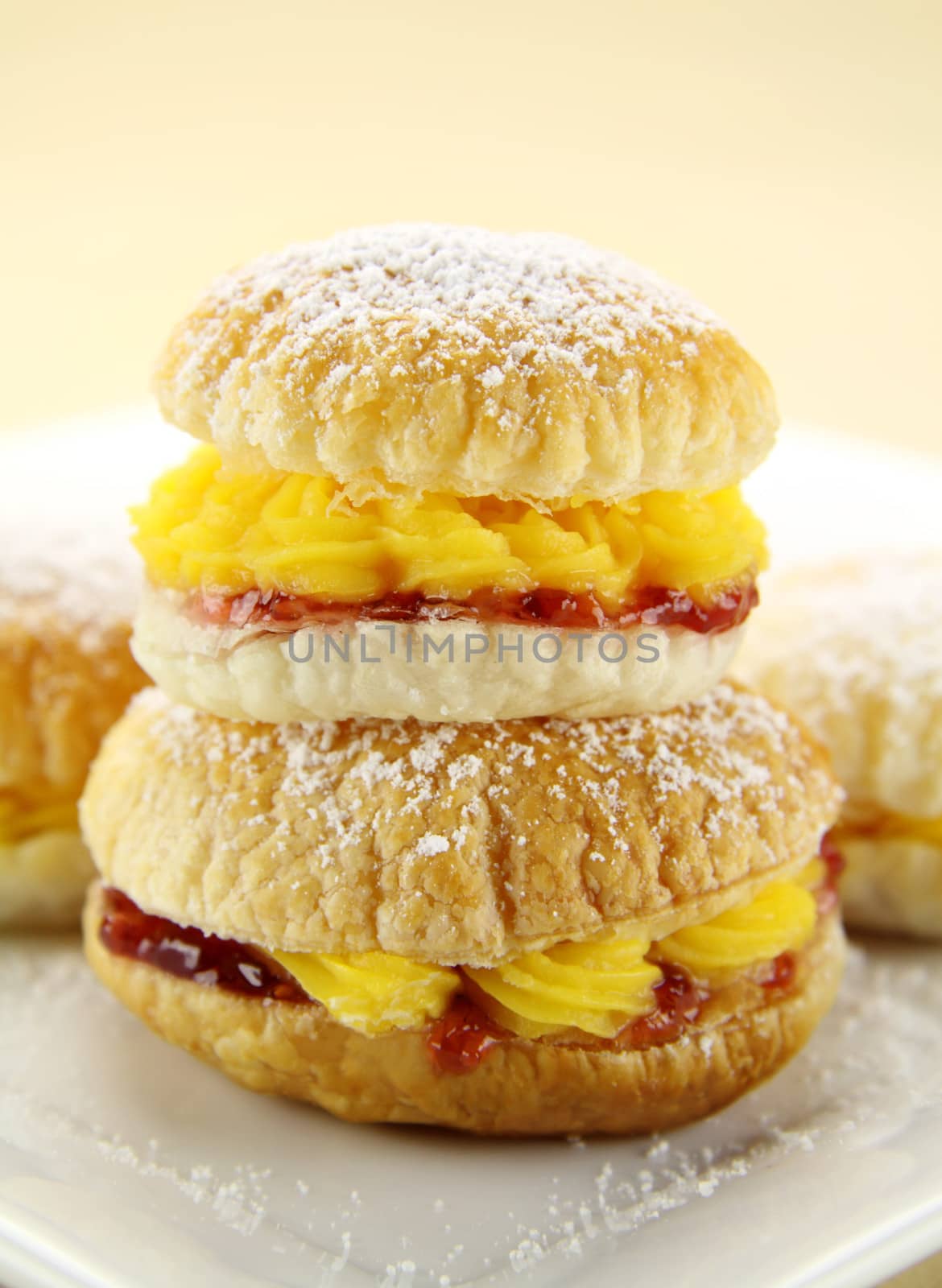 Custard pastry cakes stacked on top of one another.