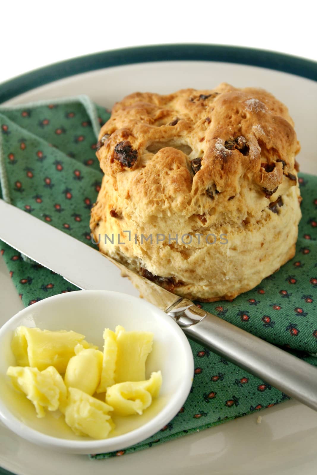 Fresh baked date scone with butter curls.