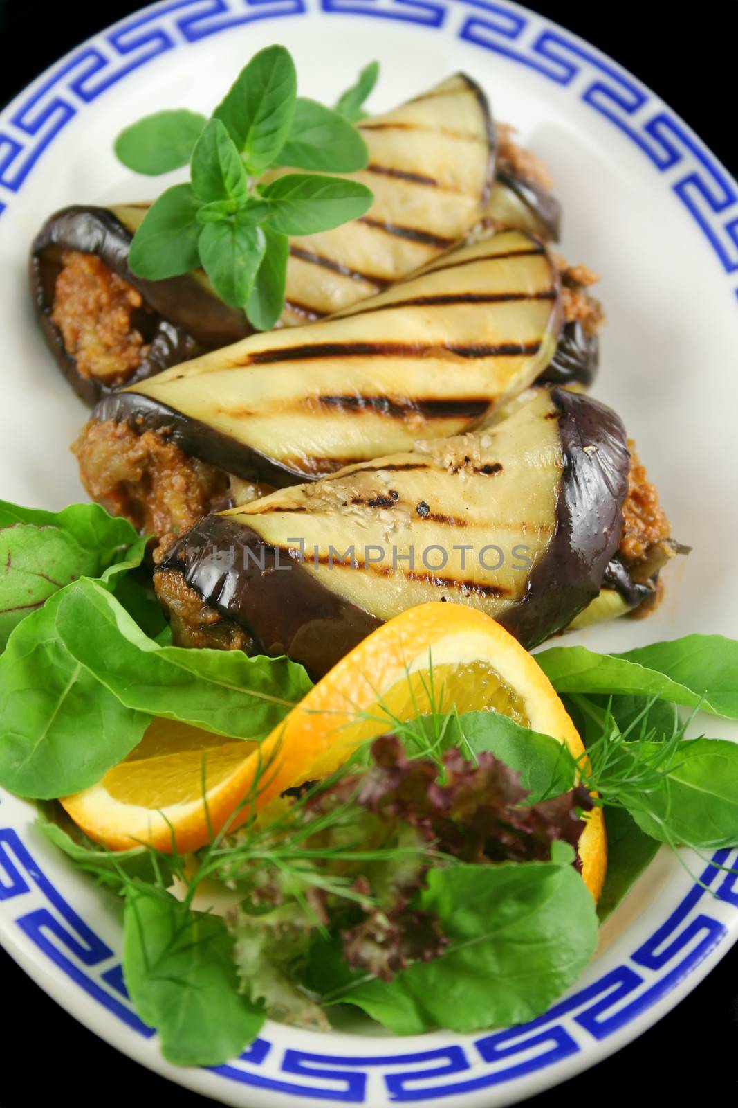 Chargrilled egg plant and beef rolls with an orange and fennel salad.