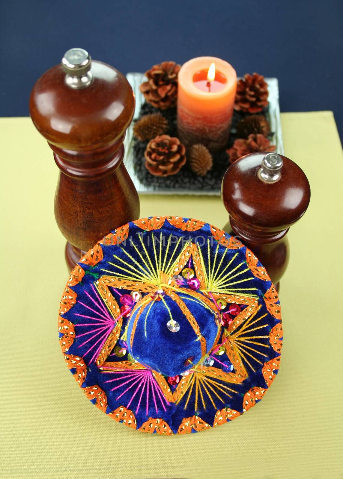 Sombrero with salt and pepper mills and a candle for a Mexican influence.
