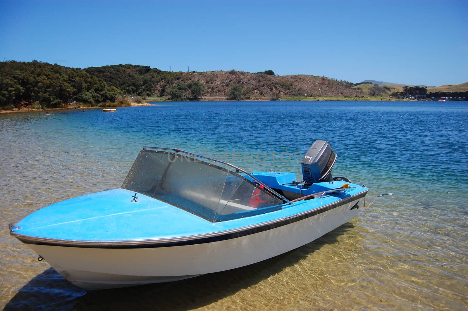 Motor boat at lake near coast, New Zealand