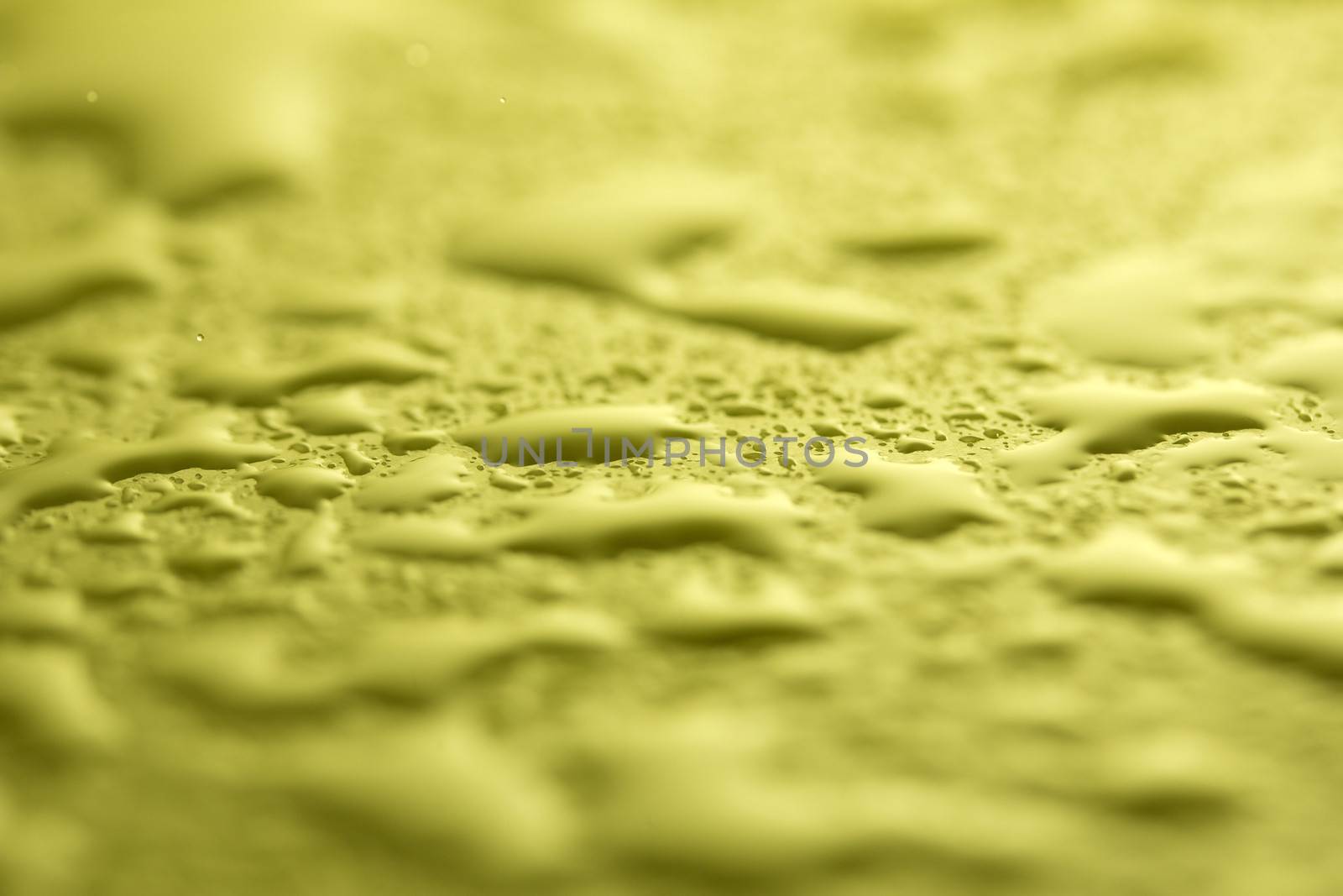 Effect with water drops on green textile 