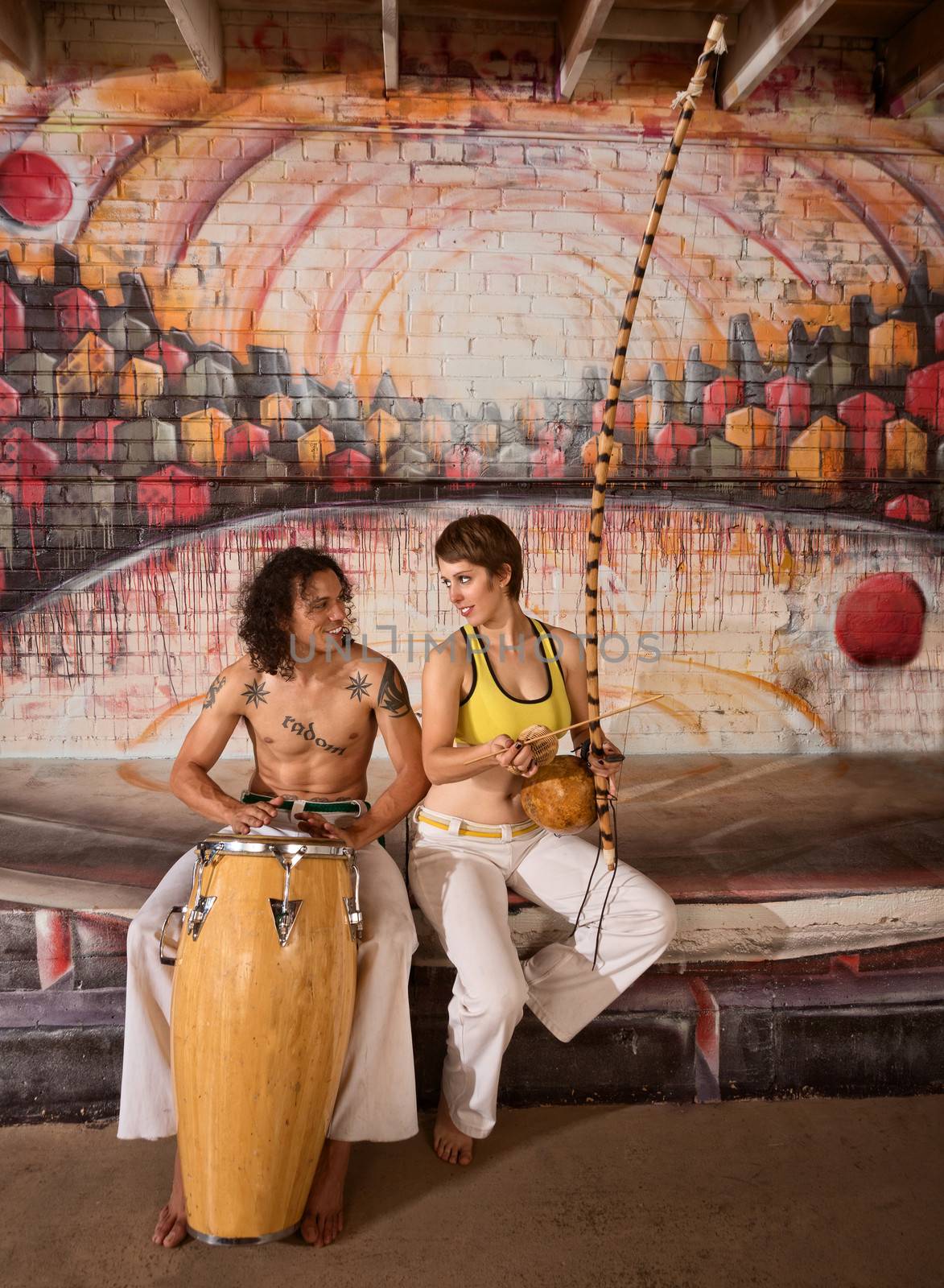 Capoeira Couple Playing Music by Creatista