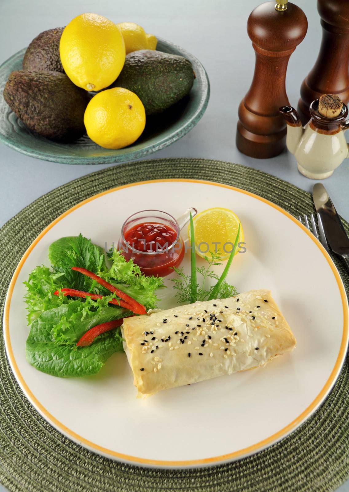 Fresh baked vegetarian carrot and feta filo rolls ready to serve.