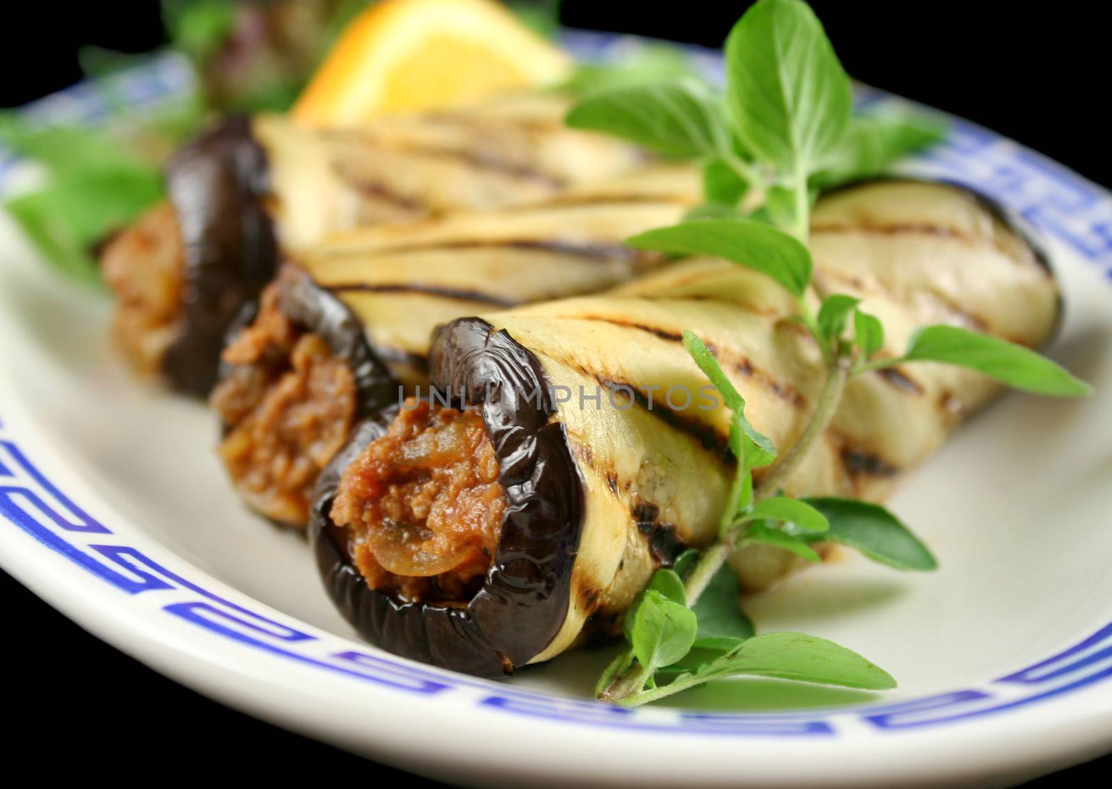 Chargrilled egg plant and beef rolls with an orange and fennel salad.