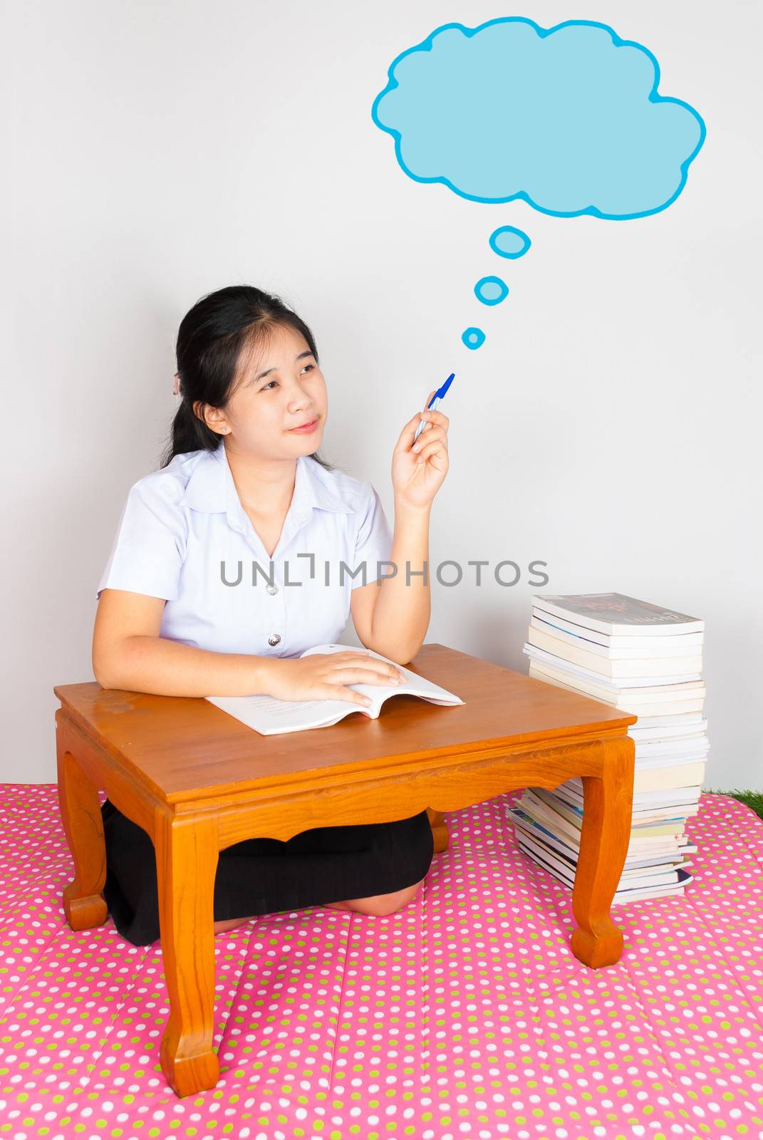 Asian Thai Student points the cloud of thinking or idea