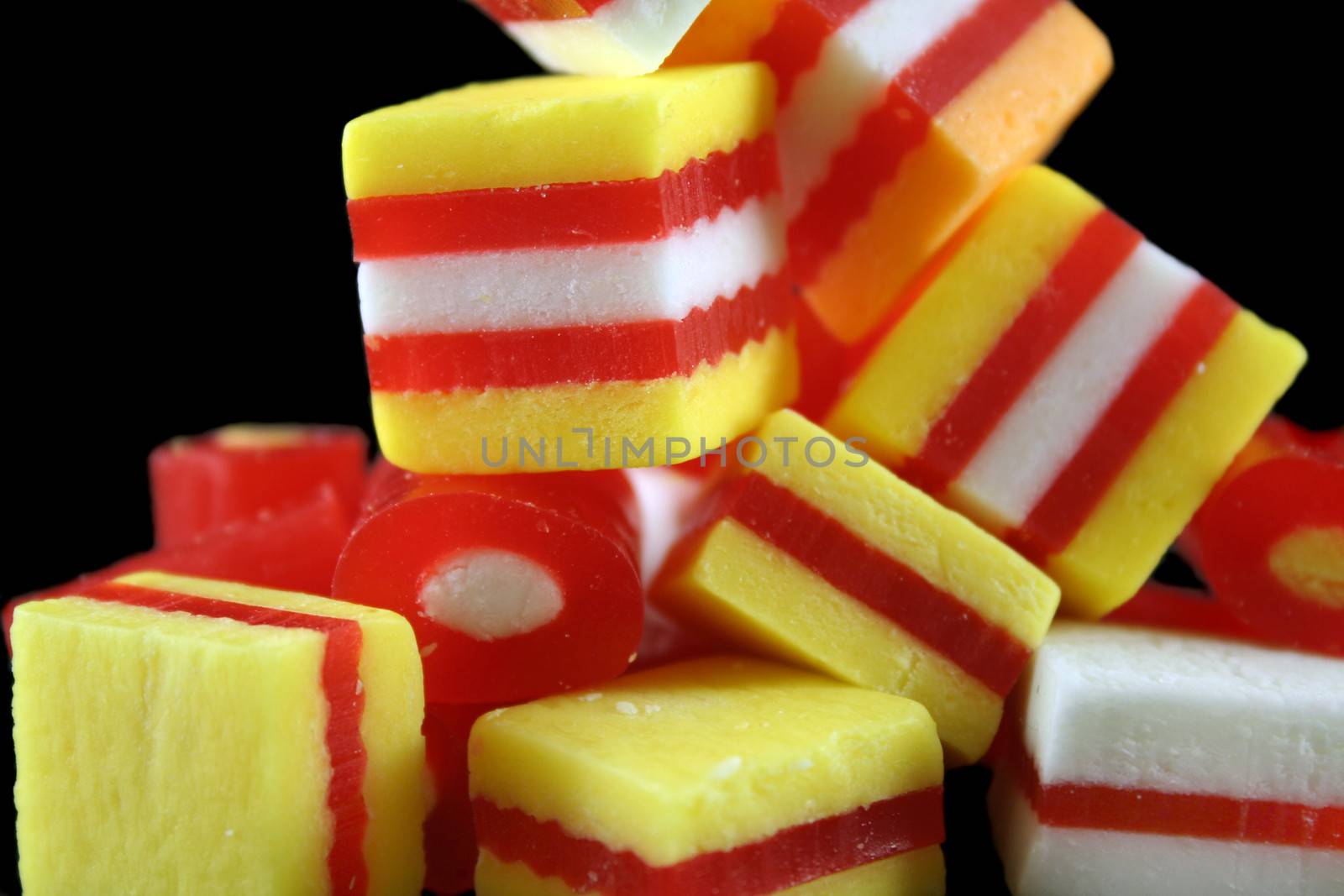 Colorful striped fruit flavored candies ready to eat.