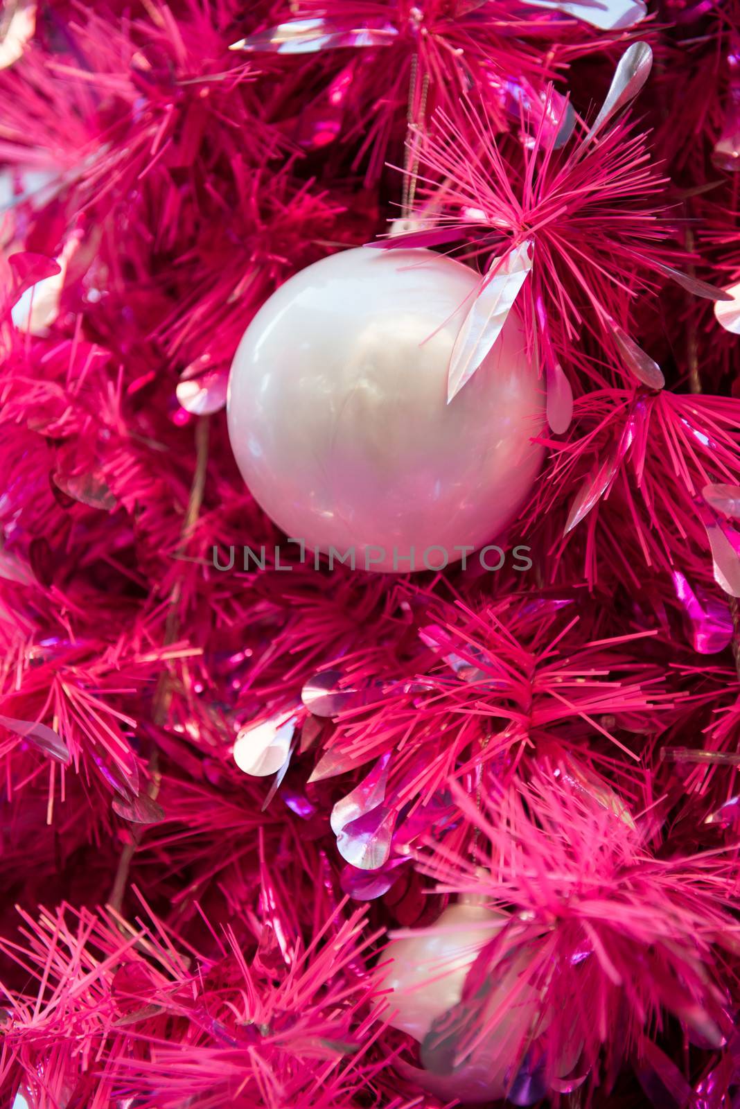 Purple Christmas decoration sphere and tree branches