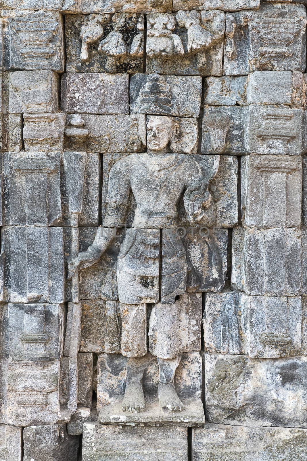 Images of Boddhisattva on wall of Perwara (guardian) temple in Candi Sewu complex. Candi Sewu means 1000 temples, which links it to the legend of Loro Djonggrang. In fact this complex has 253 building structures (8th Century) and it is the second largest Buddhist temple in Java, Indonesia.