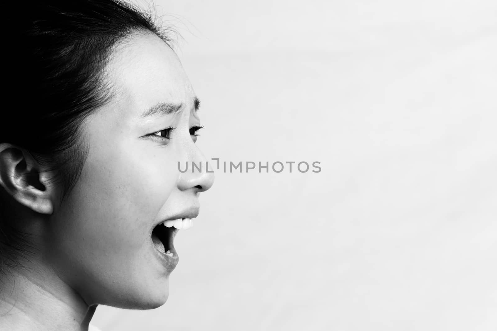 Portrait of woman yelling by IVYPHOTOS