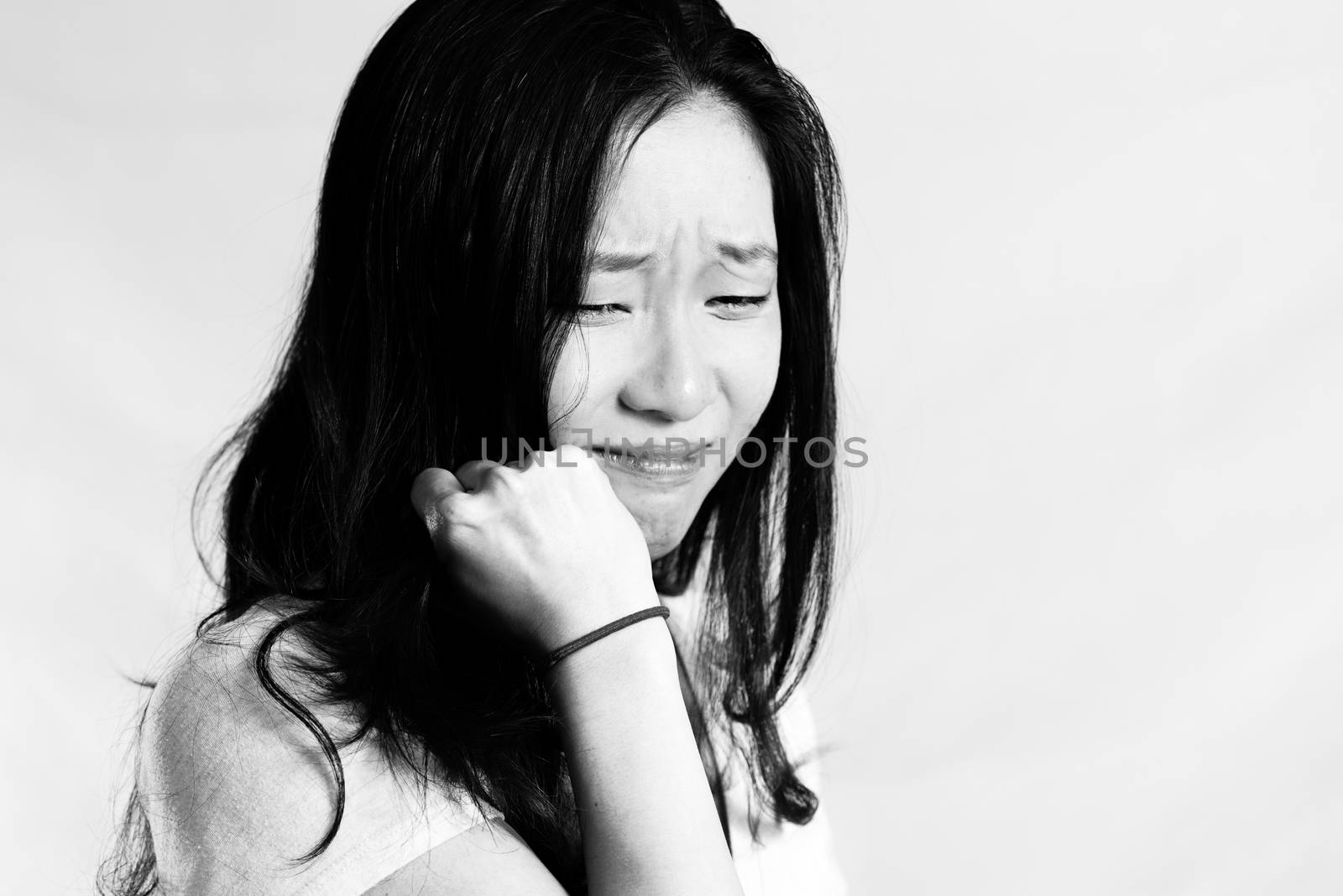 Portrait of young woman crying by IVYPHOTOS