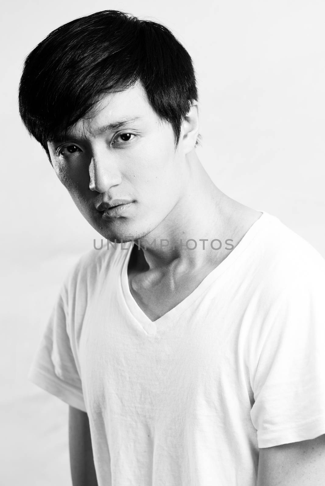 Portrait of handsome young man with cool pose, black and white style