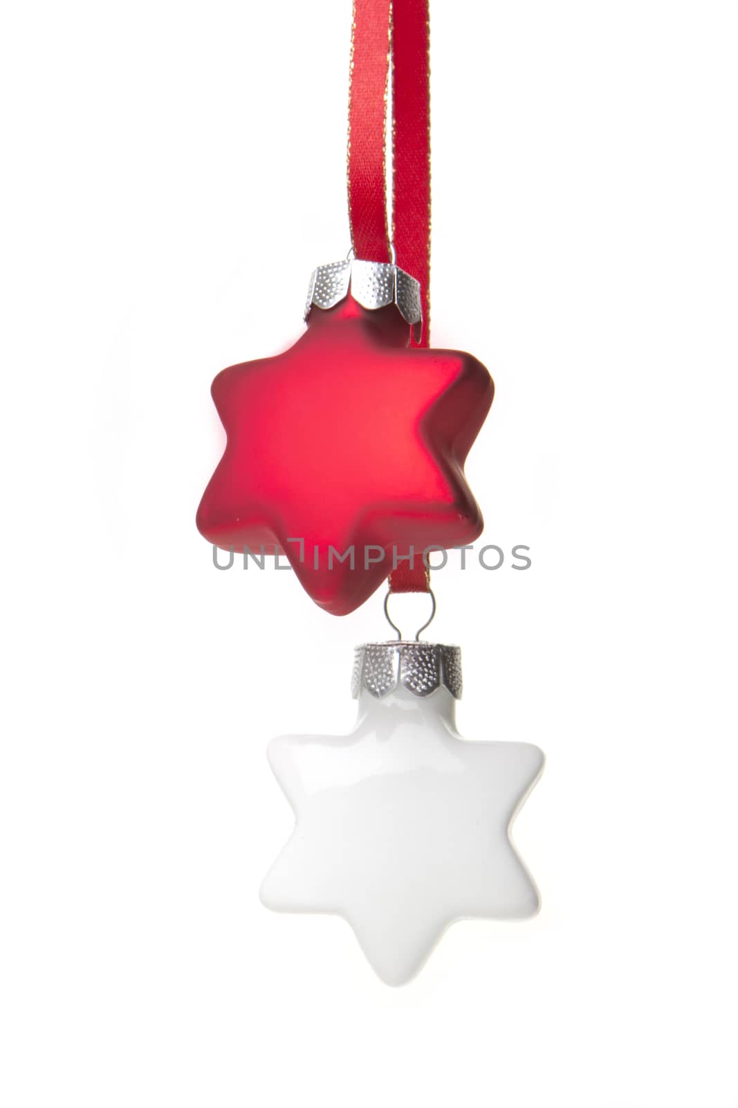 white and red christmas baubles as christmas star hanging isolated with white background 
