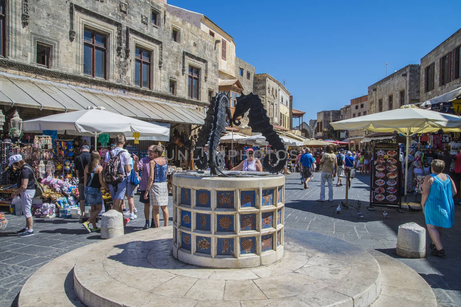 busy street in the old town of rhodes by steirus