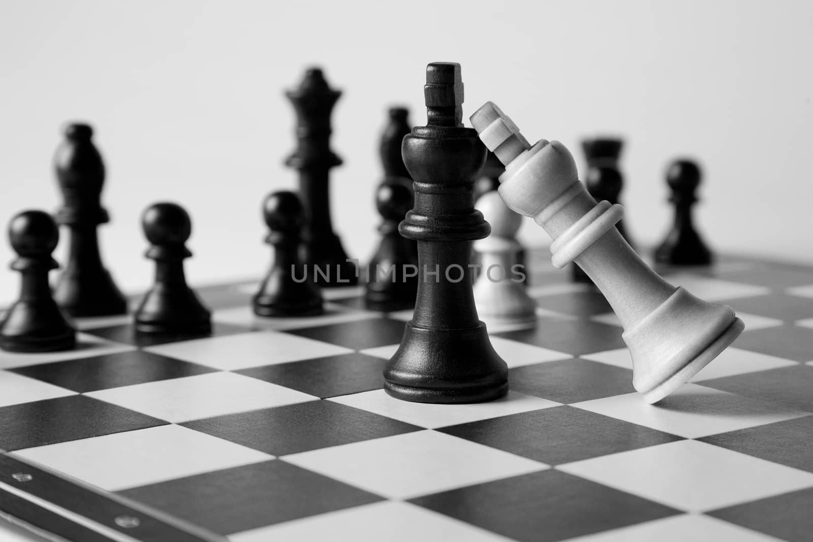 Black and white king on a chess board