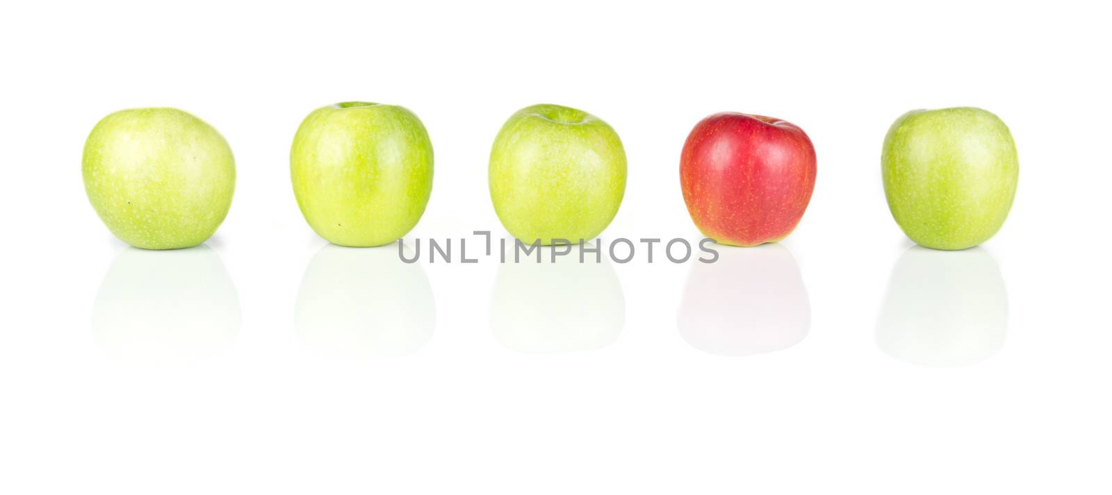 Line of green apples and one red apple isolated on white