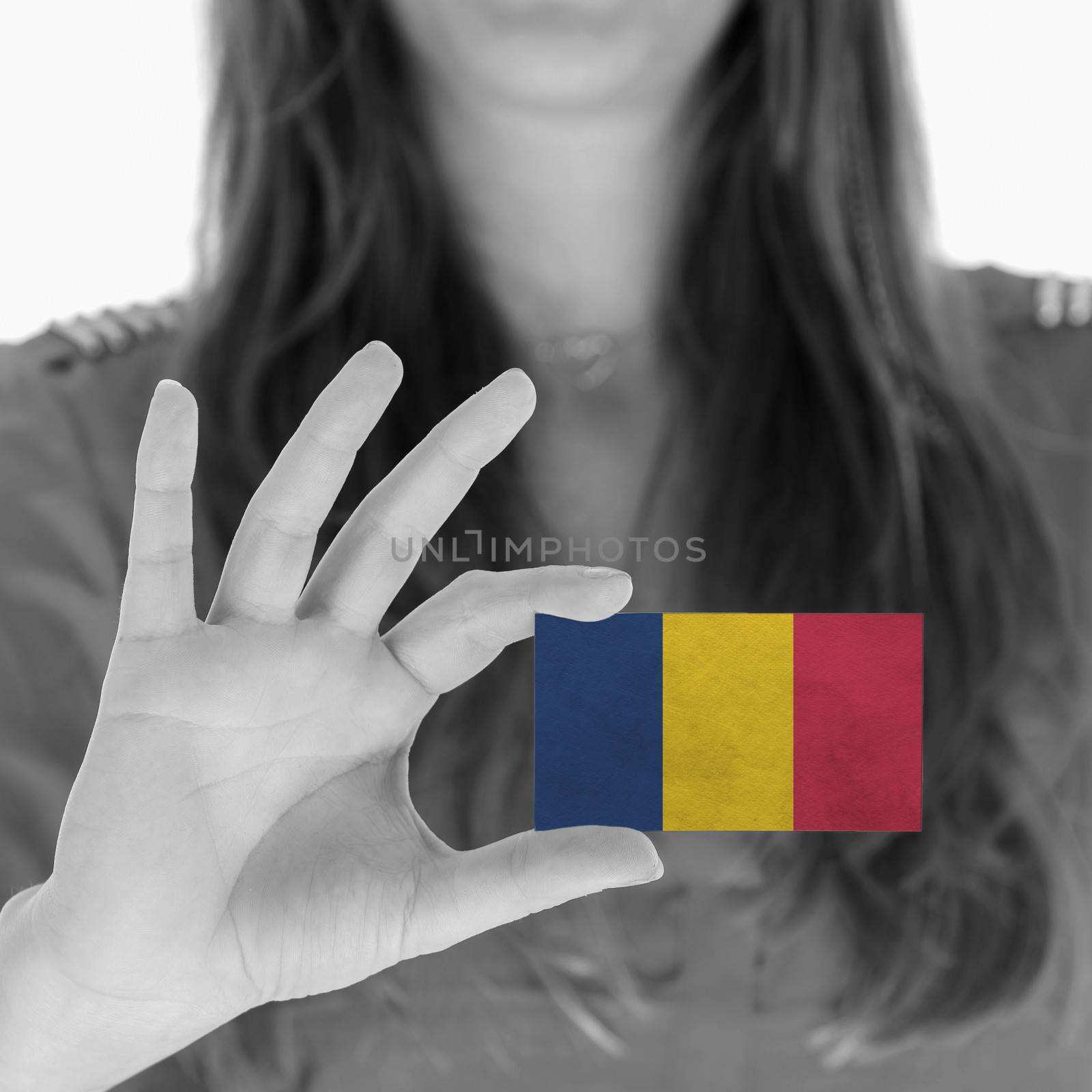 Woman showing a business card, flag of Chad