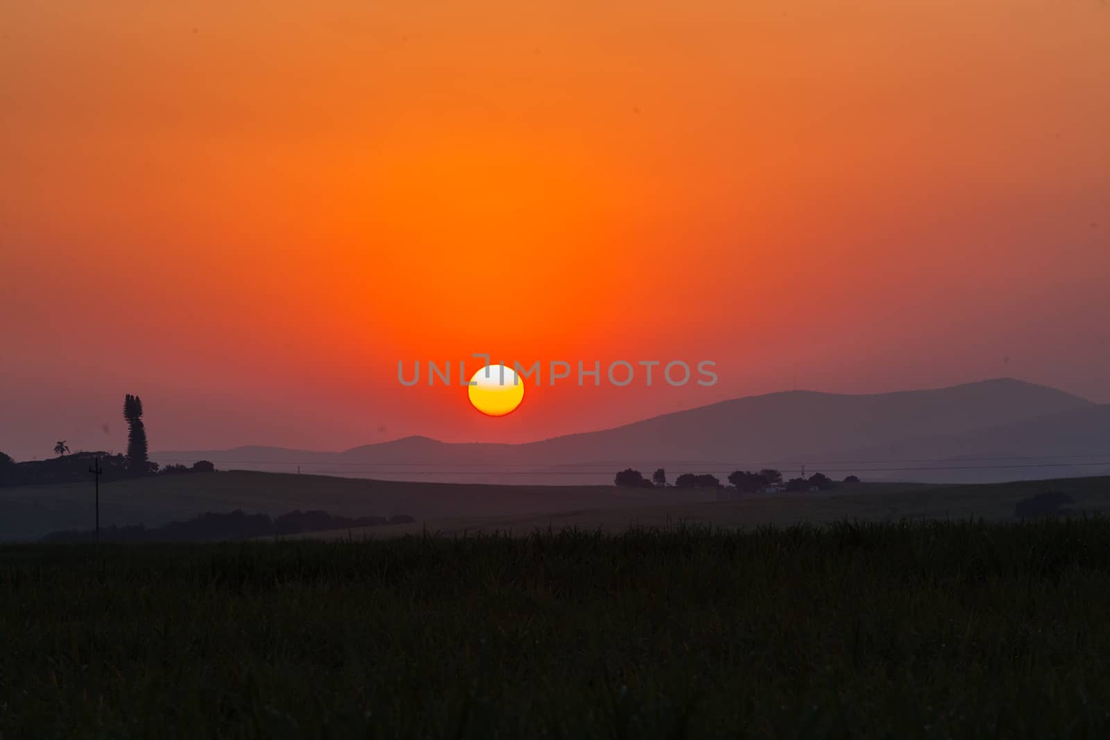 Sun setting over the scenic landscape on winters day