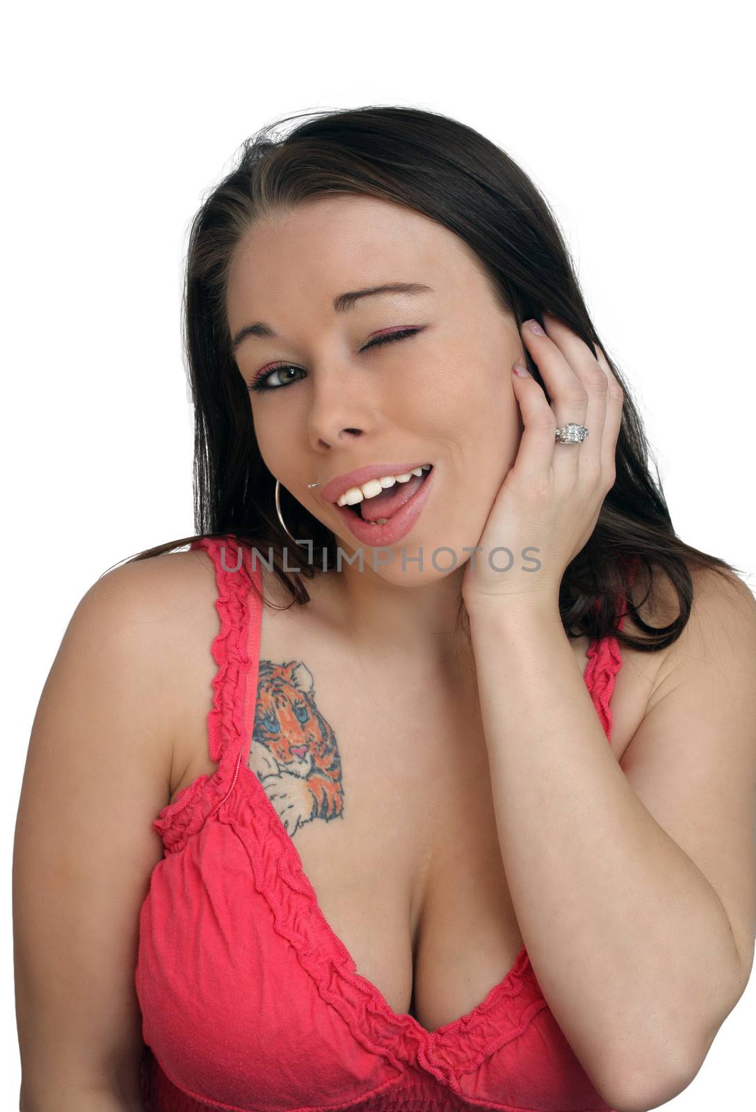 Close-up of a lovely, busty young brunette winking at you.  Isolated on a white background.