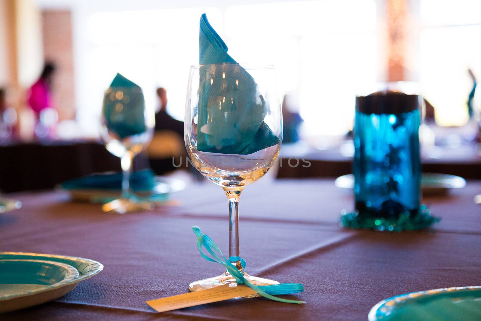 Wine glasses are setup as decor for this wedding reception.