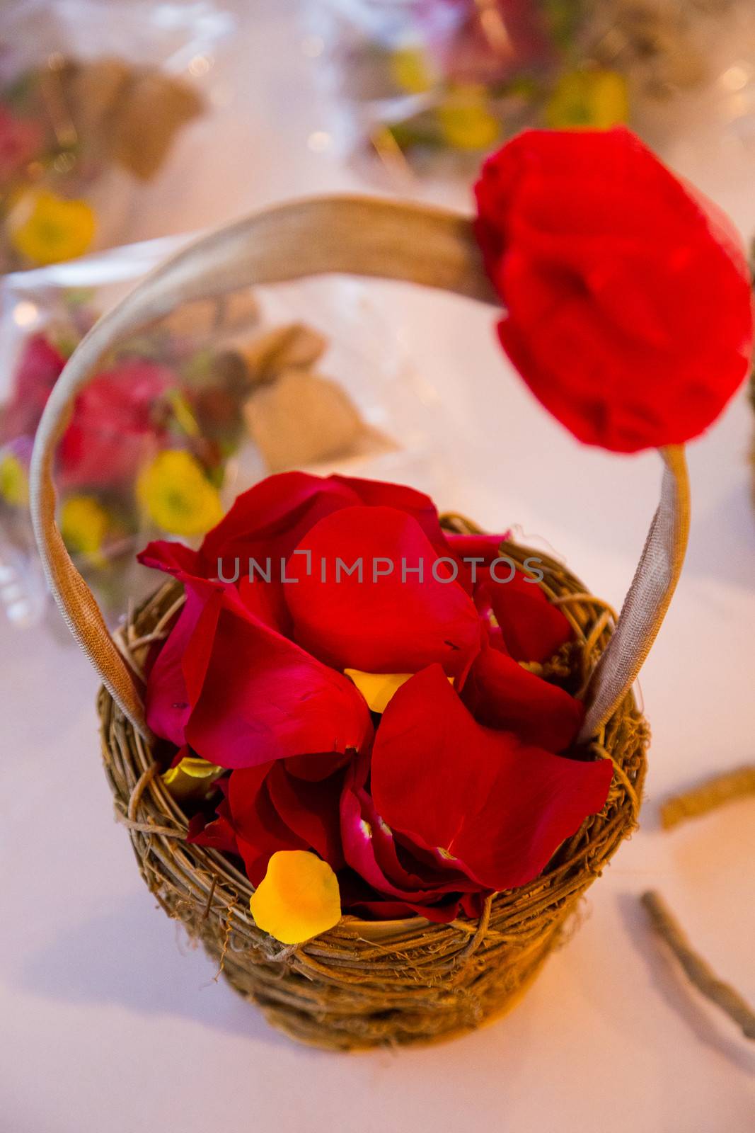 A flower girl basket sits on it's own while waiting for the wedding ceremony to start.