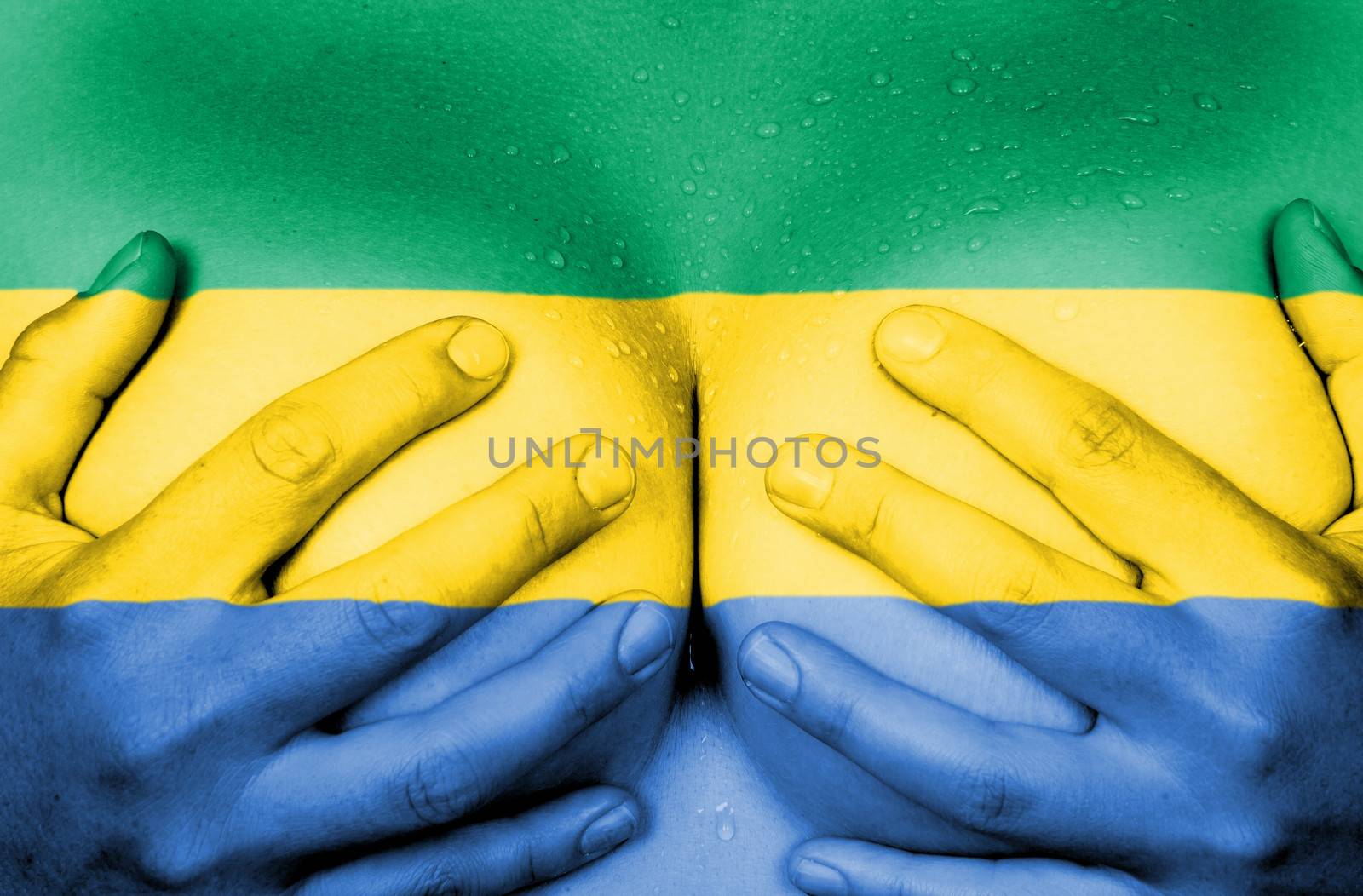 Sweaty upper part of female body, hands covering breasts, flag of Gabon