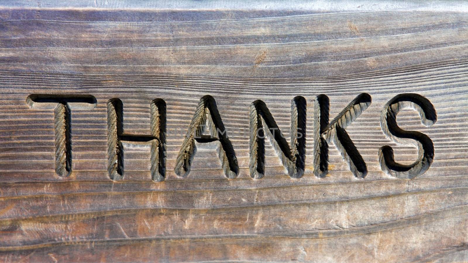 Thanks words in carved in wood