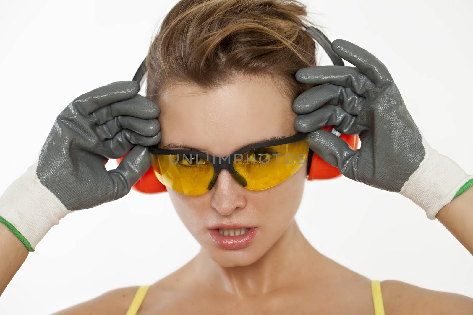 Portrait of girl in goggles and gloves construction