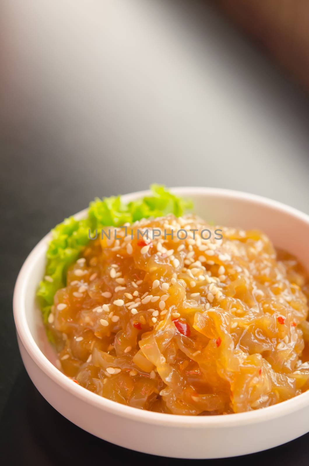 gourmet tossed jellyfish salad in white bowl , Chinese cuisine
