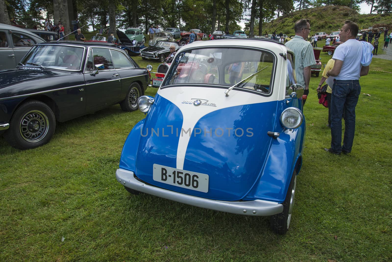 The image is shot at Fredriksten fortress in Halden, Norway during the annual classic car event.