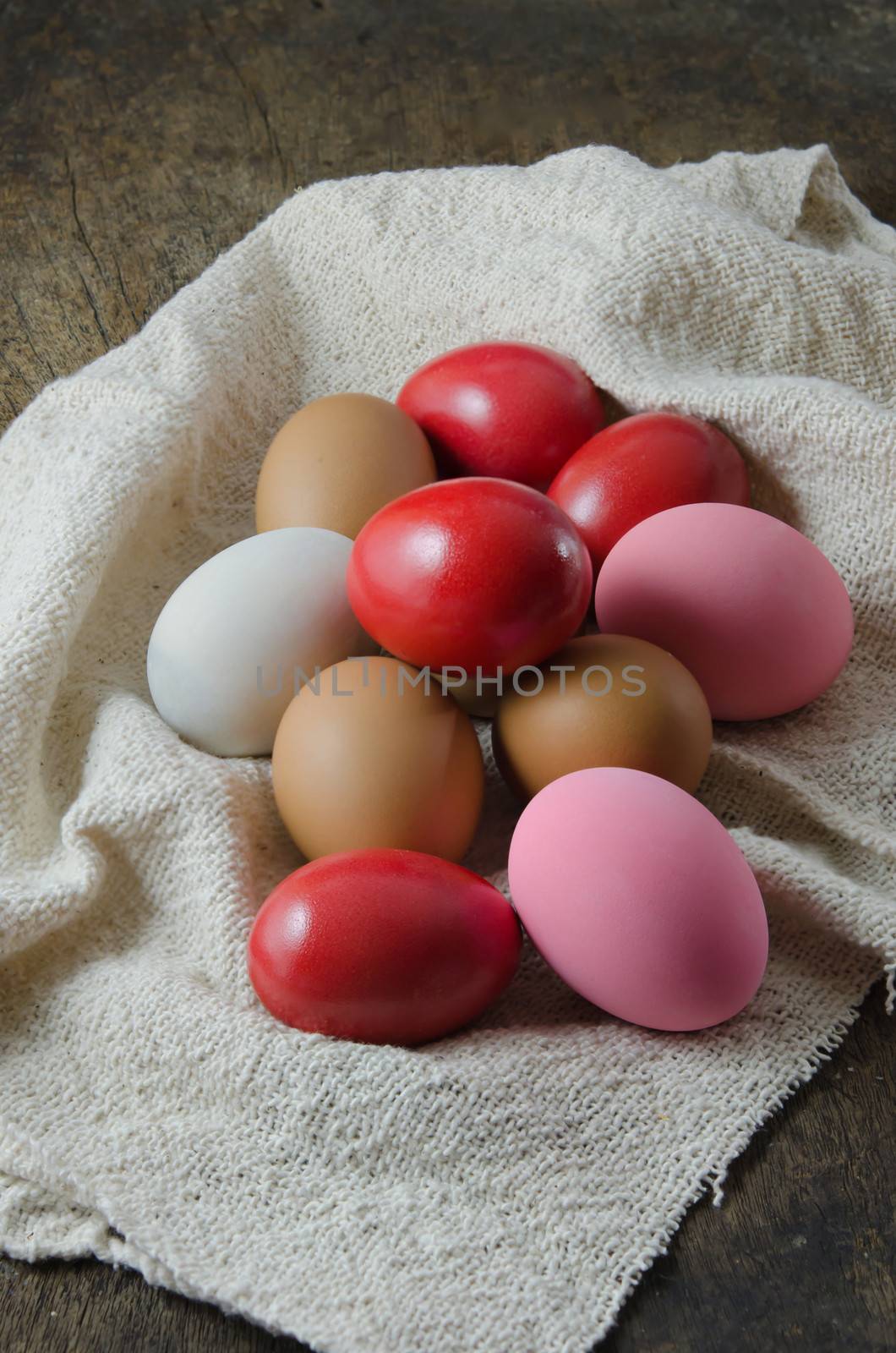 colorful of  eggs  on  sackcloth over wooden background