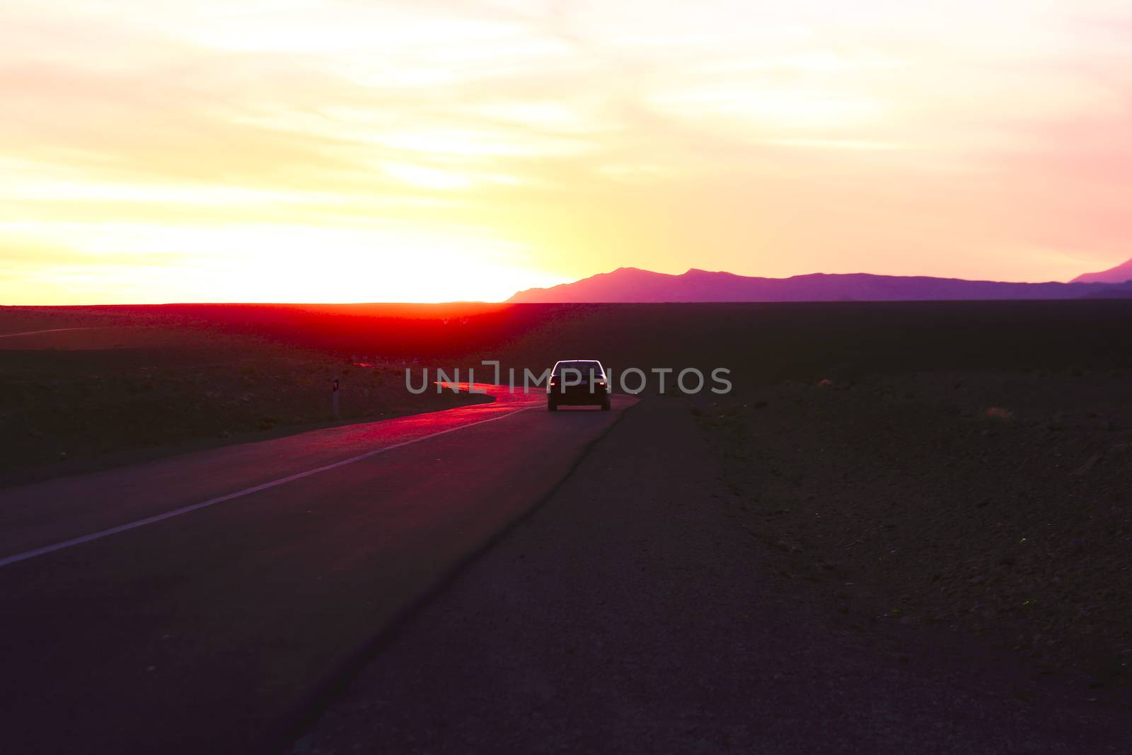 Driving in the desert at sunset in Morocco Africa