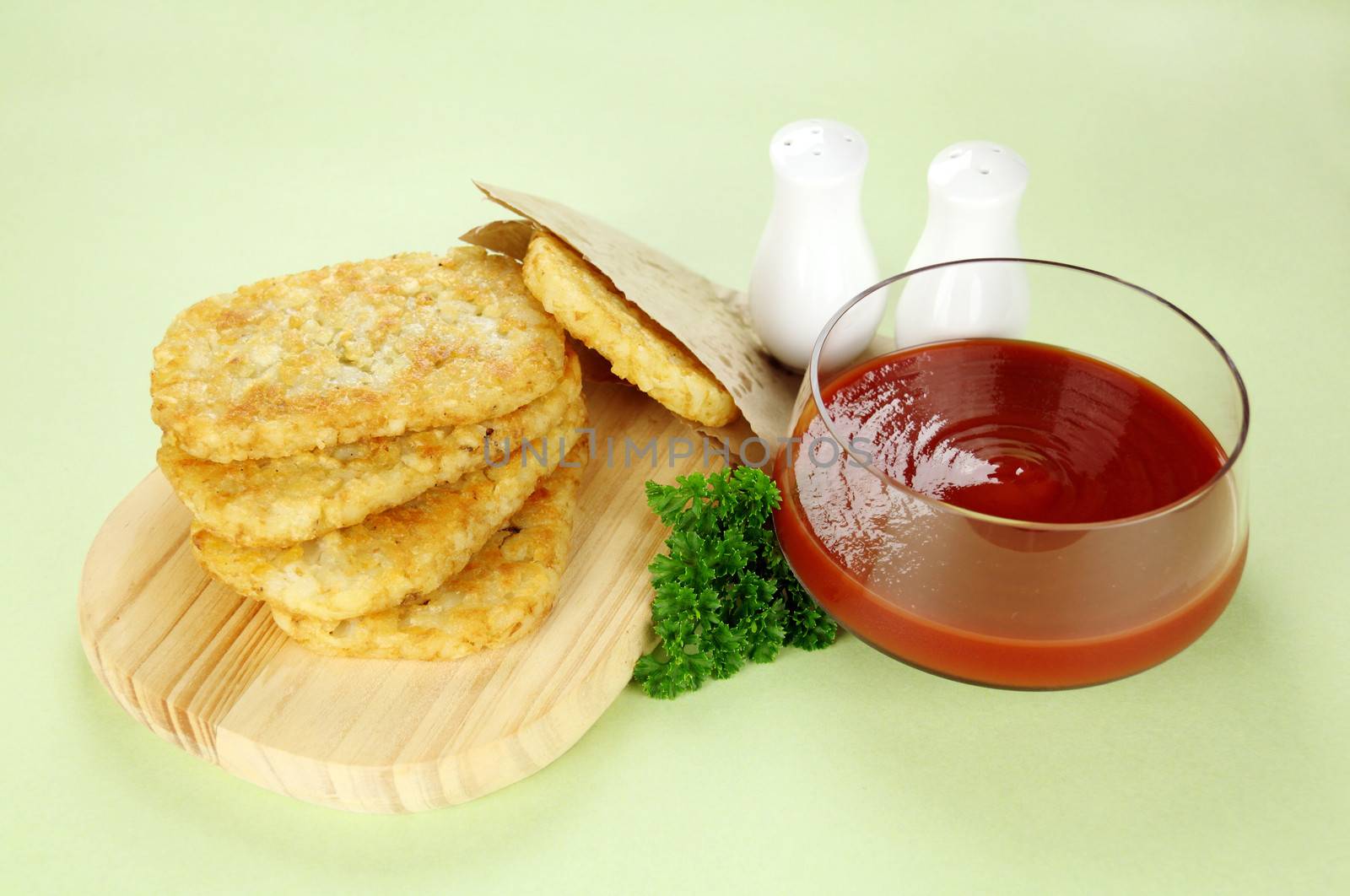 Hash browns with ketchup and parsley ready to serve.