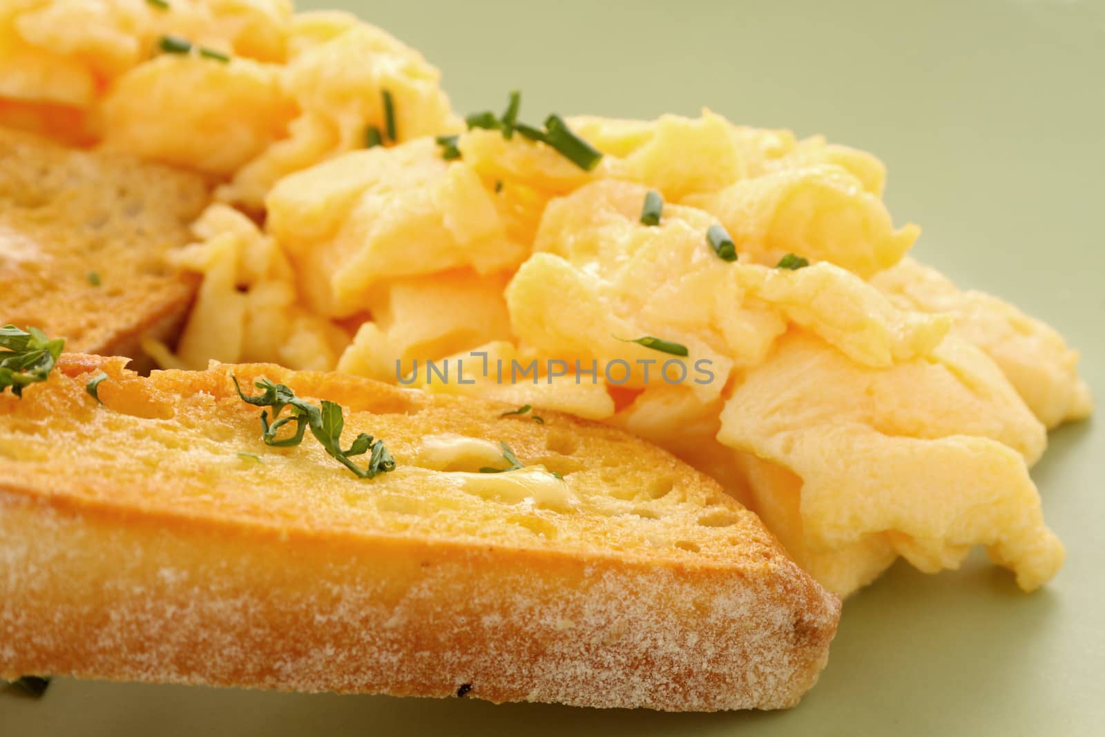 Delicious and healthy breakfast of scrambled eggs with Turkish bread toast.