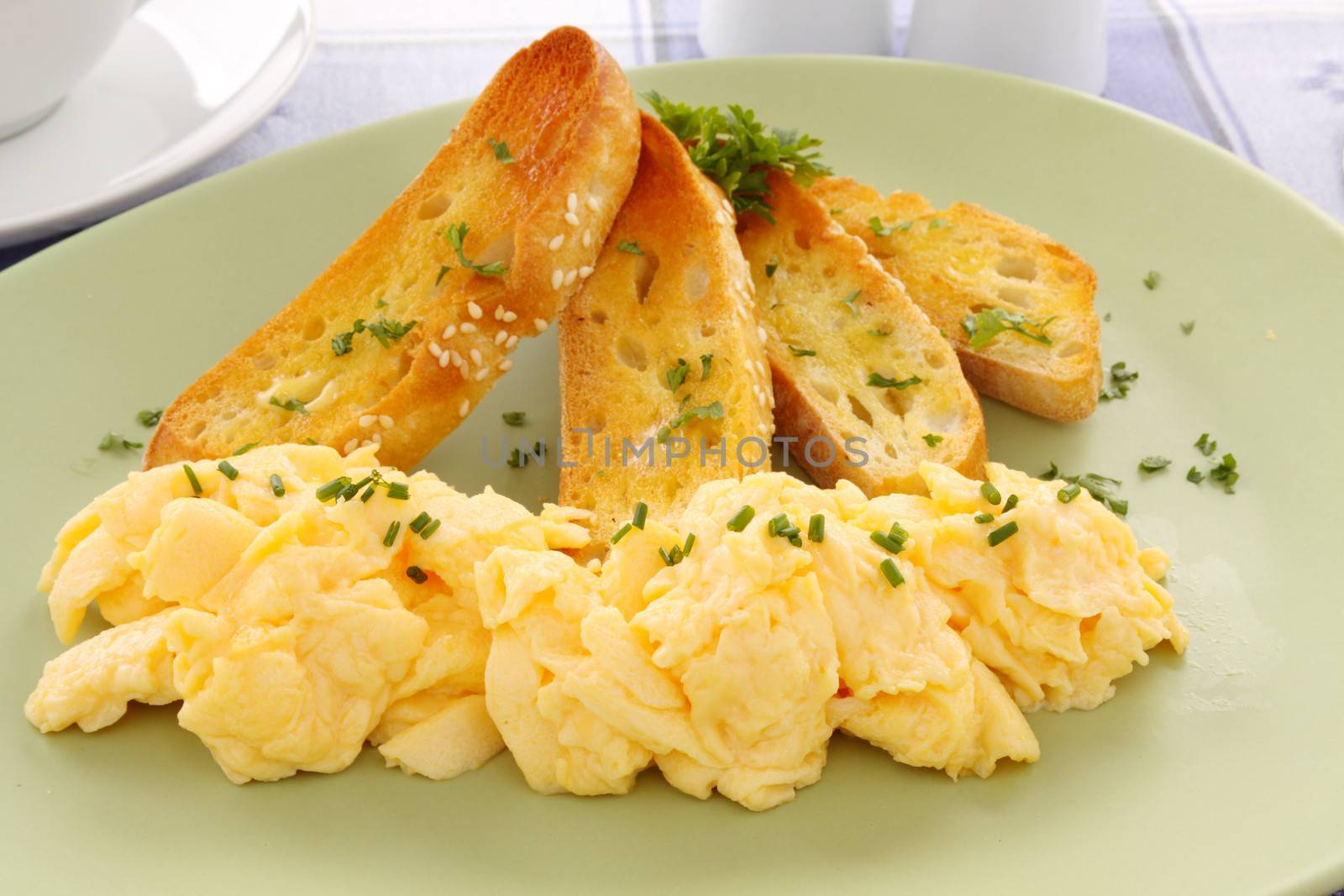 Delicious and healthy breakfast of scrambled eggs with Turkish bread toast.
