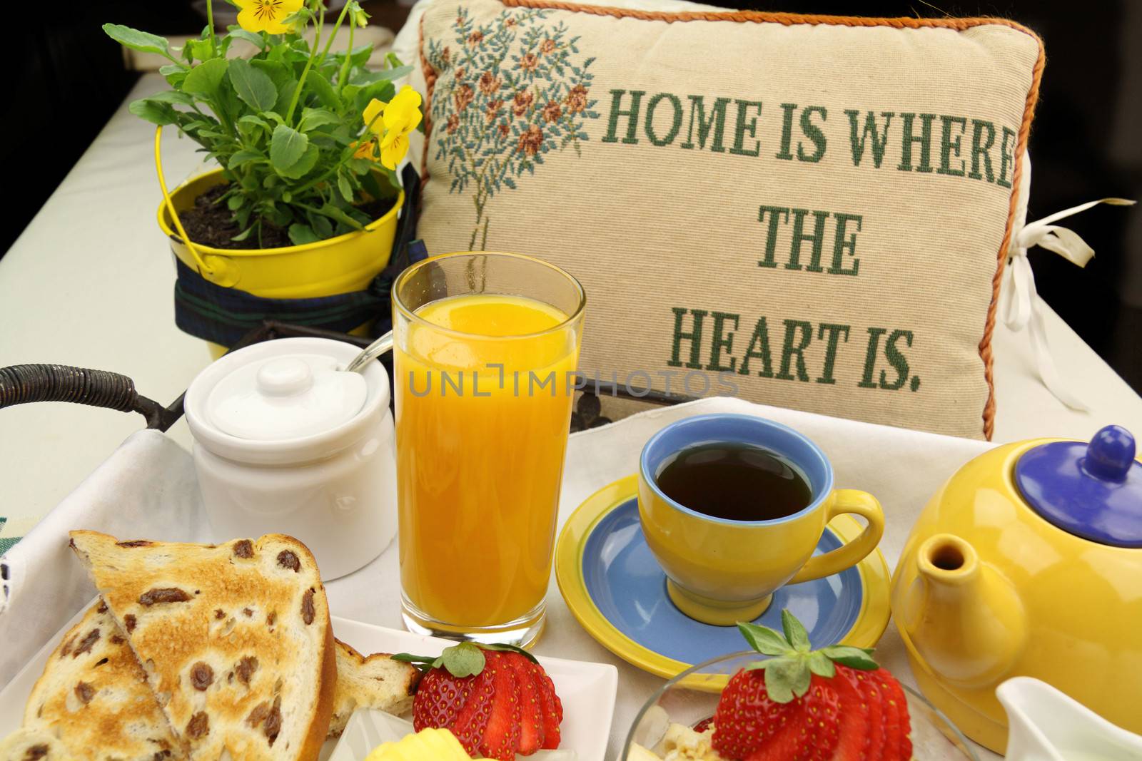 Breakfast with tea, orange juice, toast and muesli ready to serve.