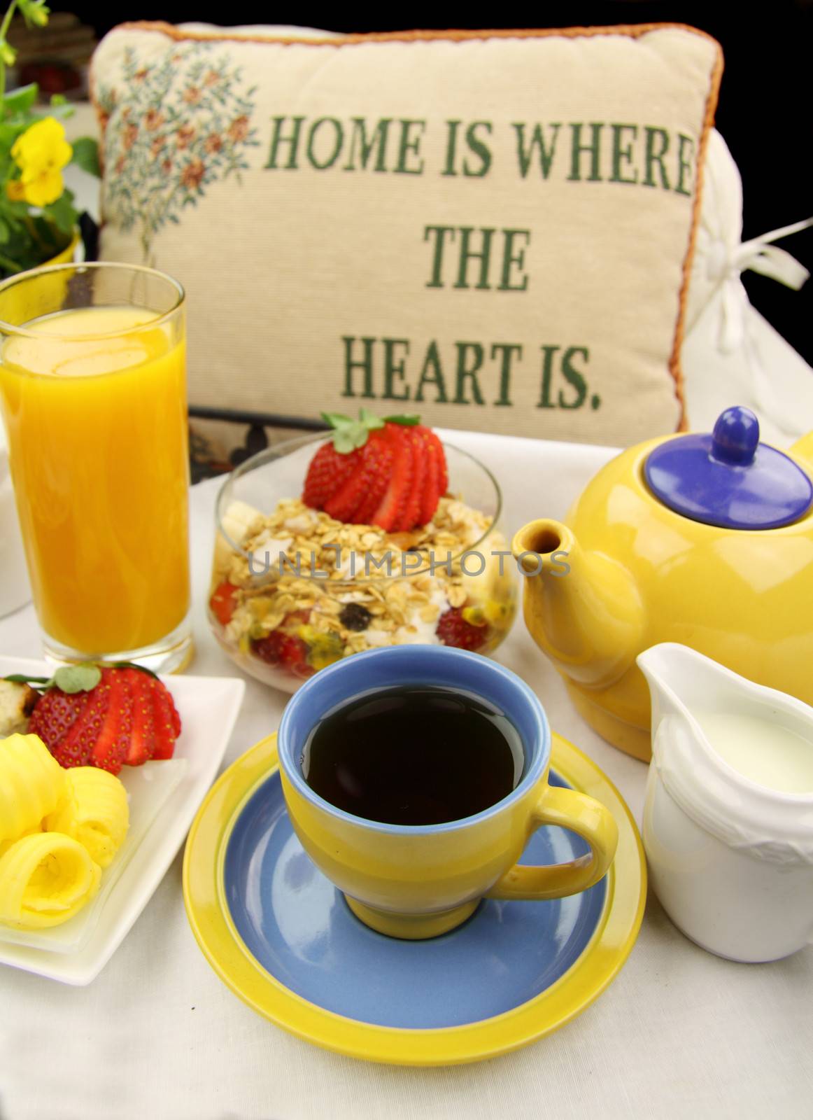 Breakfast with tea, orange juice and muesli ready to serve.